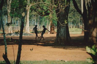 Two boys playing outdoors