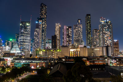 Illuminated buildings in city at night