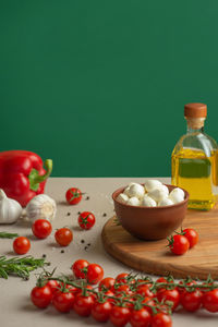 Mozzarella salad ingredients on colored background