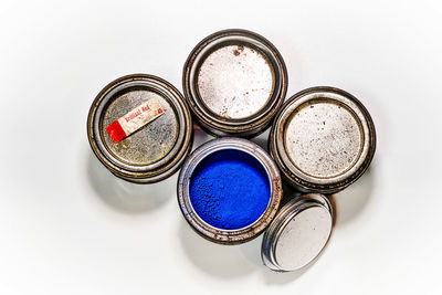 High angle view of coins on white background