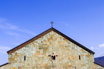 Low angle view of building against blue sky