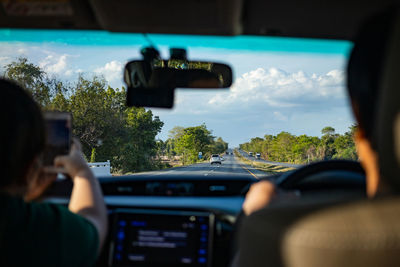 Rear view of man driving car