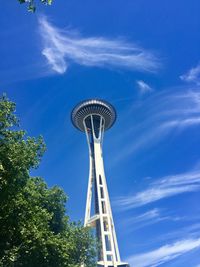 Low angle view of  space needle tower against cloudy sky