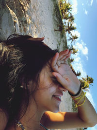 Portrait of woman smiling with plants