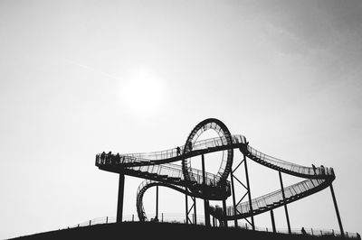 Low angle view of ferris wheel against sky