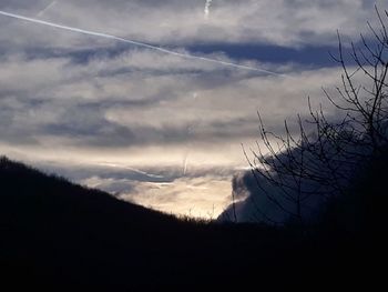 Scenic view of silhouette mountain against sky at sunset