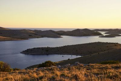 Scenic view of sea against clear sky during sunset