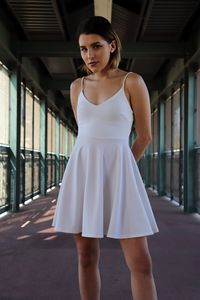 Portrait of woman standing in corridor