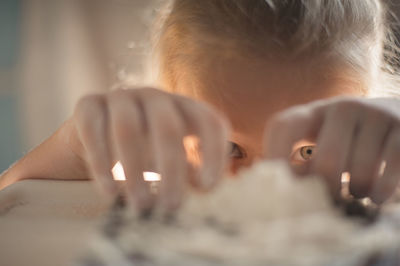 Girl playing with flour. close-up portrait of a girl playing with flour