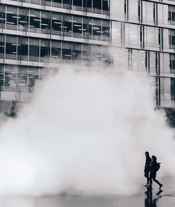 Man in front of building