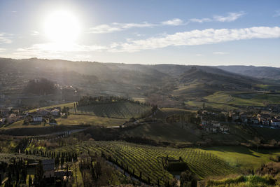 Scenic view of agricultural field against sky