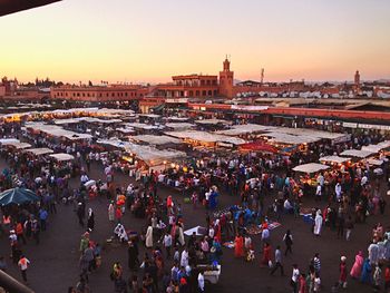 People in city at sunset