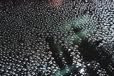 Full frame shot of wet glass window