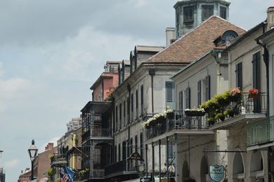 Houses in city against sky