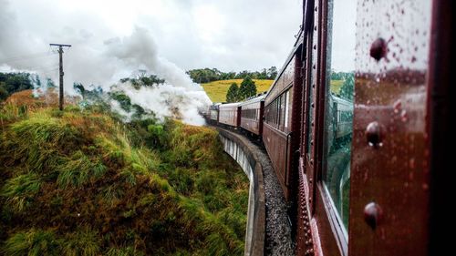 Steam train on railroad track