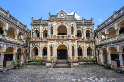 Facade of historic building against clear sky