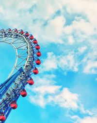 Low angle view of ferris wheel against sky