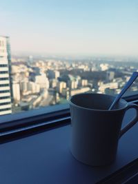 Close-up of coffee cup against clear sky