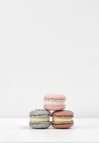 Close-up of macaroons against white background