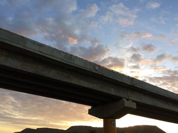 Low angle view of elevated road against sky