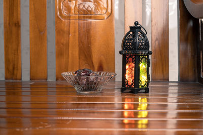 Close-up of illuminated lighting equipment on table