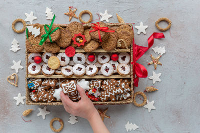 High angle view of hand holding cookies