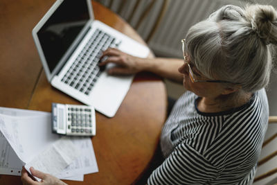 Senior woman using laptop