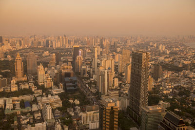 High angle view of modern buildings in city against sky