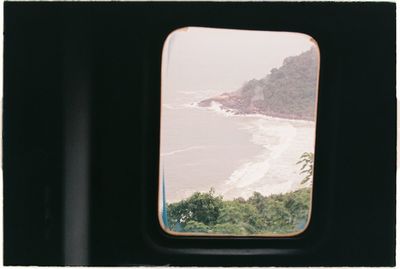 Scenic view of mountains seen through train window