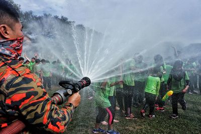 Panoramic view of people splashing water