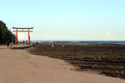 Scenic view of beach against clear sky