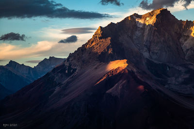 Panoramic view of snowcapped mountains against sky during sunset