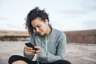 Girl listening music from mobile