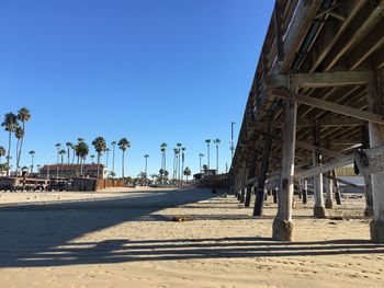 Low angle view of bridge against clear blue sky