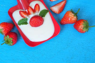 High angle view of strawberries on table