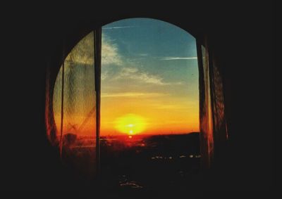 Sunset seen through window