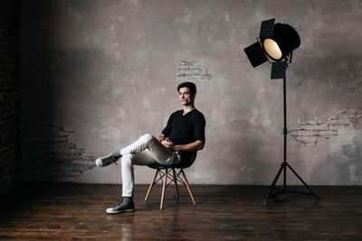 Portrait of man sitting on chair