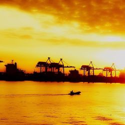 Silhouette of commercial dock at sunset