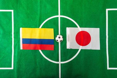 Directly above shot of soccer ball amidst flags