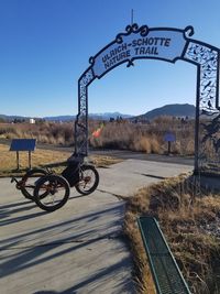 Bicycle on road against clear sky