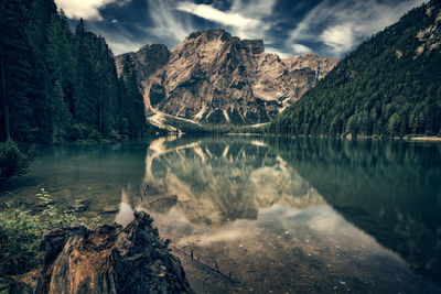 Scenic view of lake and mountains against sky