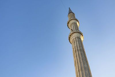 Mosque minaret and blue sky