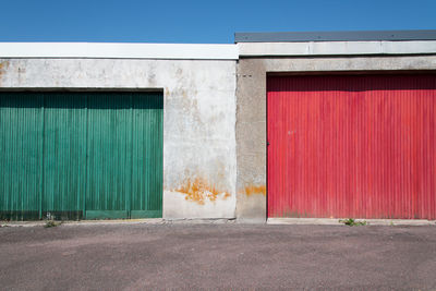 Closed doors of building during sunny day