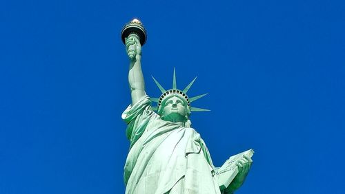 Statue of liberty against clear blue sky