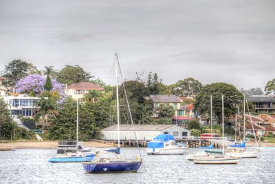 Boats in swimming pool against sky