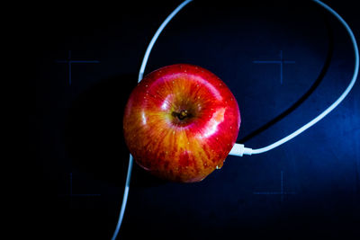 Close-up of apple against black background