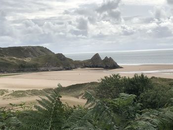 Scenic view of beach against sky