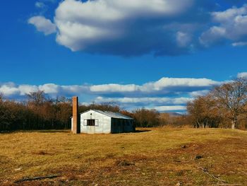 House on field against sky