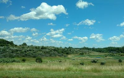 Scenic view of landscape against cloudy sky