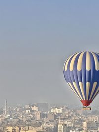 Hot air balloons flying against sky